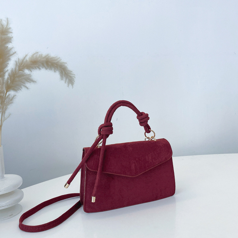 2024 otoño y invierno temperamento diseño de moda de un solo hombro aire extranjero color sólido retro textura simple bolso portátil