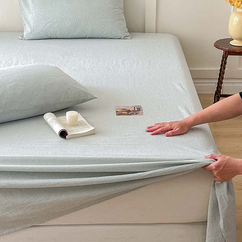 Nueva sábana de algodón puro sábana de algodón funda de cama de una pieza protectora de colchón cama de dormitorio antideslizante juego de tres piezas 1,5 metros