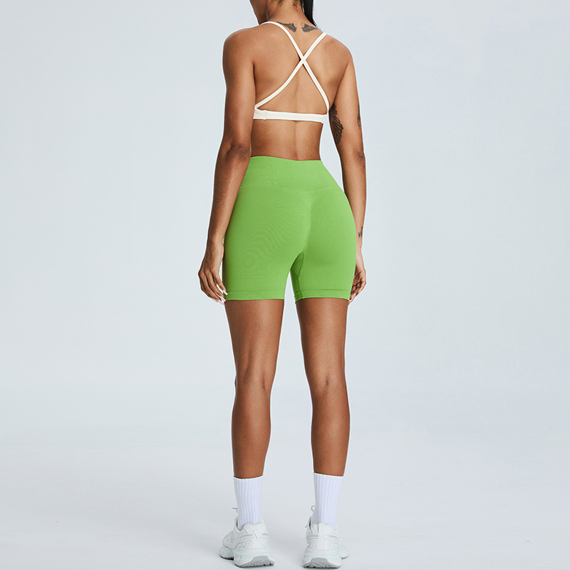 Nuevo traje de yoga sin costuras europeo y americano, pantalones cortos de yoga de cadera de melocotón para mujer, traje deportivo de carrera de espalda cruzada