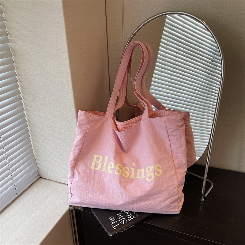 Capacious double-sided nylon shopping bag