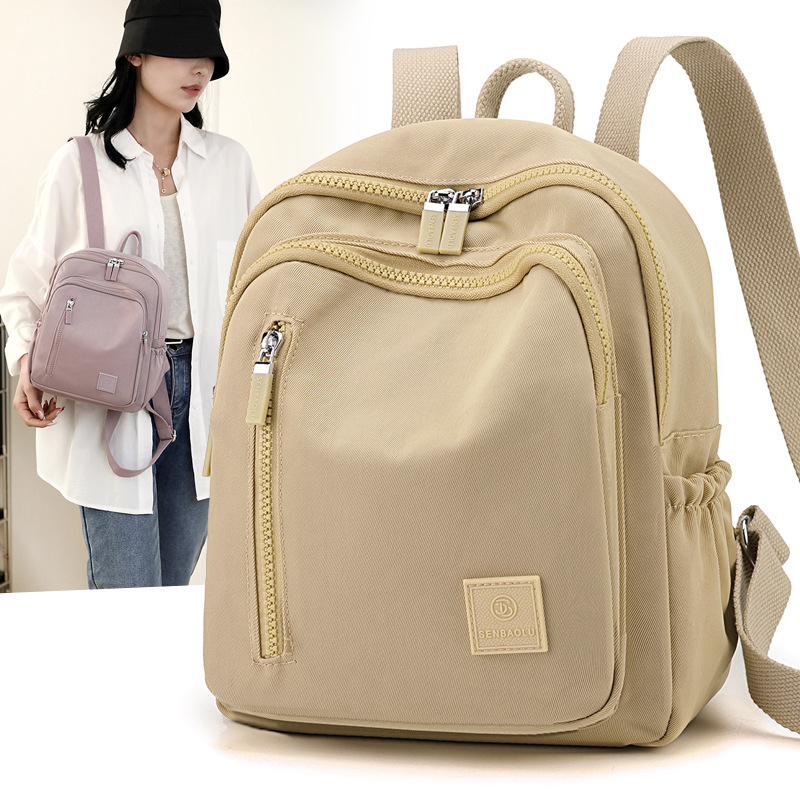 Mochila sencilla e informal para mujer, bolso portátil de gran capacidad para viajes y desplazamientos, mochila versátil de tela de nailon de gran capacidad para mujer