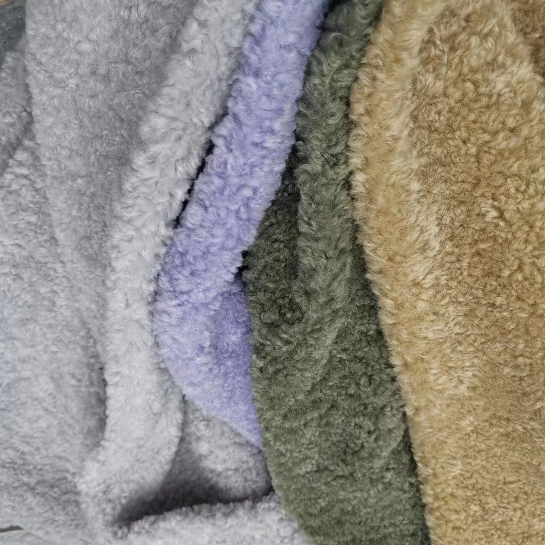 Imitación de lana lana rollo de lana de grano pequeño de cachemira de grano Fei Fei cordero ropa bolsa tela de juguete