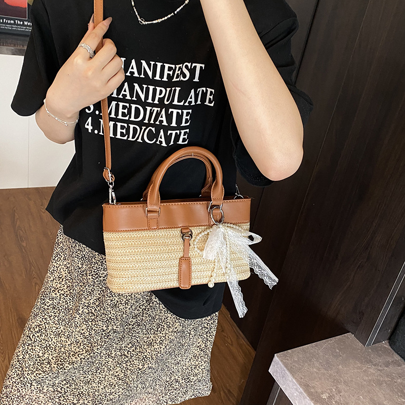 Bolso de vacaciones junto al mar 2025 verano nuevo bolso bolso de hombro de color de contraste tejido de paja bolso de mensajero de playa para mujer