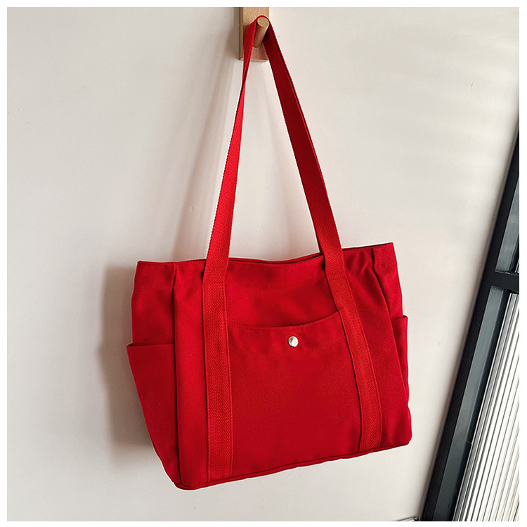 Wholesale of new women's single-shoulder bags, cross-border simple and casual canvas bags, Korean version LOGO printed commuter tote bags undefined
