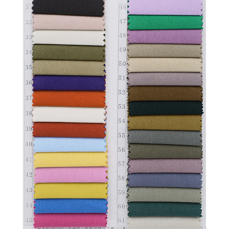 Lote de stock 285gsm 100 material de tela de algodón tejido teñido de sarga