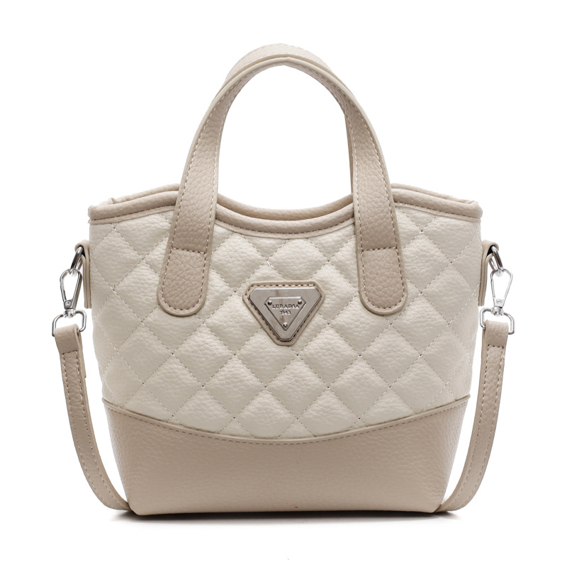 Bolso de mano de alta sensación lingue versátil para mujeres 2025, nuevo color extranjero, bolso de hombro, bolso de cubo de explosión