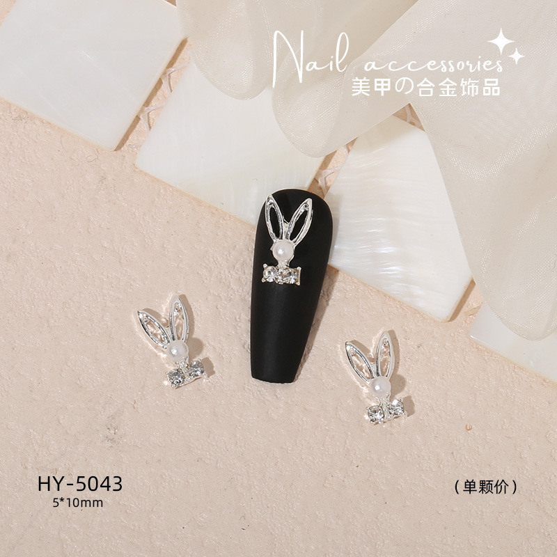 Nuevo arco de uñas amor aleación decoración de uñas flor de la luna mariposa clavo taladro fábrica joyería al por mayor