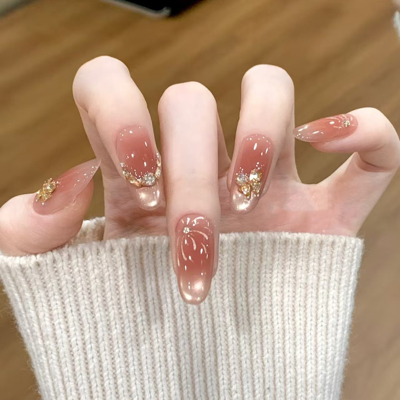 Handmade Nail Art for New Year: Dazzling Butterfly Flower Pink Glitter, Firework Cat Eye, Sparkling Rhinestones, High-End Nail Pieces