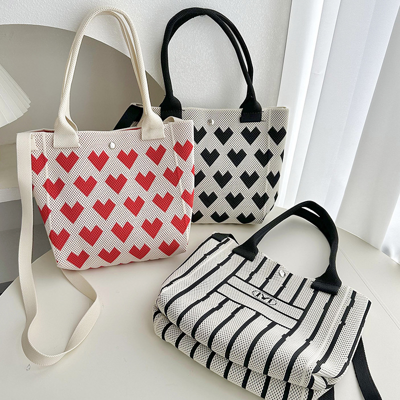 Bolsos de tejido volador Bolsos de transporte de estudiante Versión de moda Capacidad Tot 2025 Love Rayas Bolsos casuales coreanos Bolsos diagonales