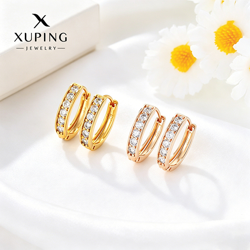 Xuping Europa y los Estados Unidos transfronterizos aleación de cobre chapado 24k aretes de color pernos de orejas incrustados en una sola fila de joyas artificiales orejas al por mayor mujeres