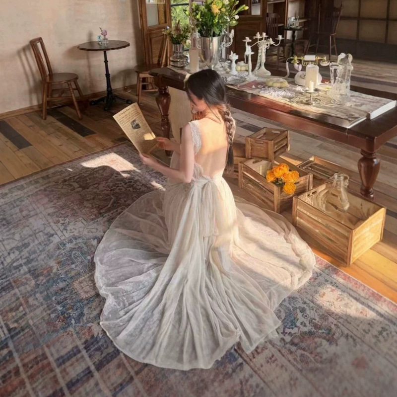 French-style white lace tie-back halter dress, perfect for summer vacations, with a flattering waistline and a stunning long design French-style white lace tie-back halter dress, perfect for summer vacations, with a flattering waistline and a stunning long design