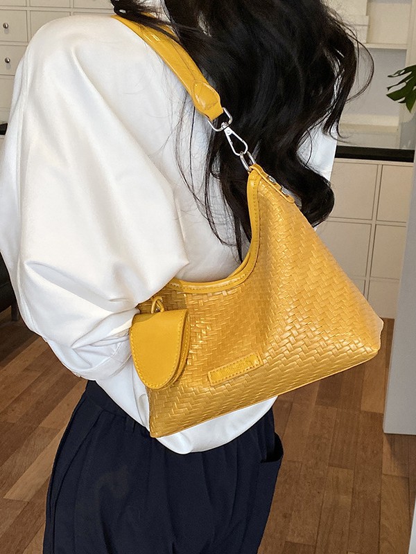Nicho de diseño de hombro brazalete para mujeres 2026 verano nueva moda trenzada mochila de viaje ocio bolsa de mano