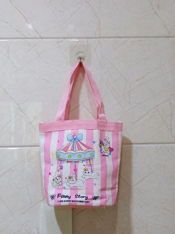かわいい落書きバケツバッグinsプリント円筒バッグキャンバス弁当袋韓風少女は弁当箱を持っています。|undefined