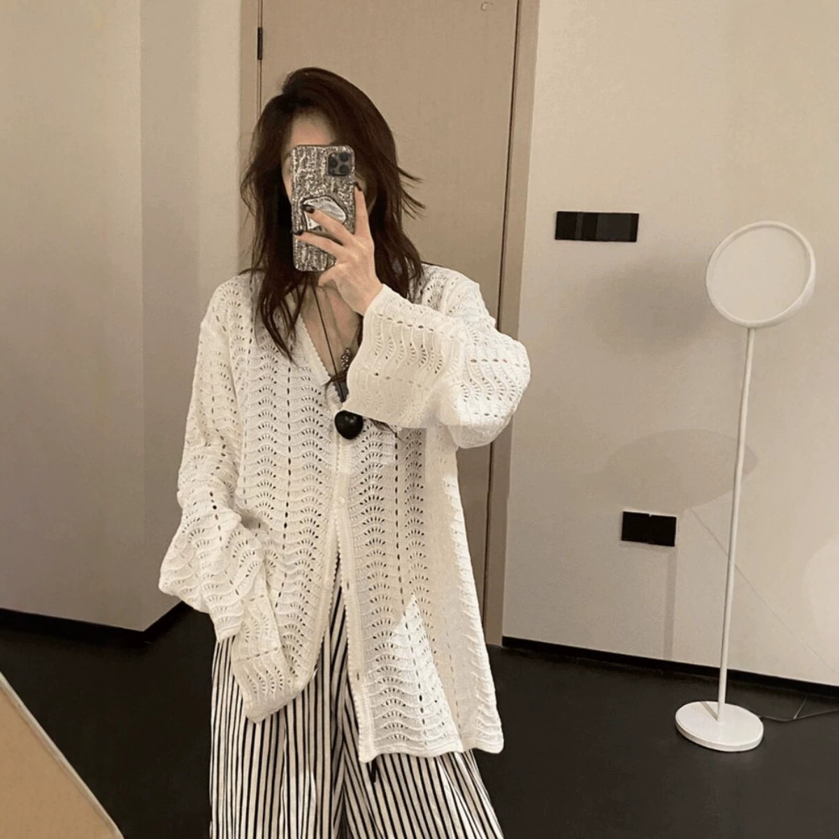 Lazy-style hollowed-out white knitted top for women, early autumn 2026 new design, long and thin cardigan.