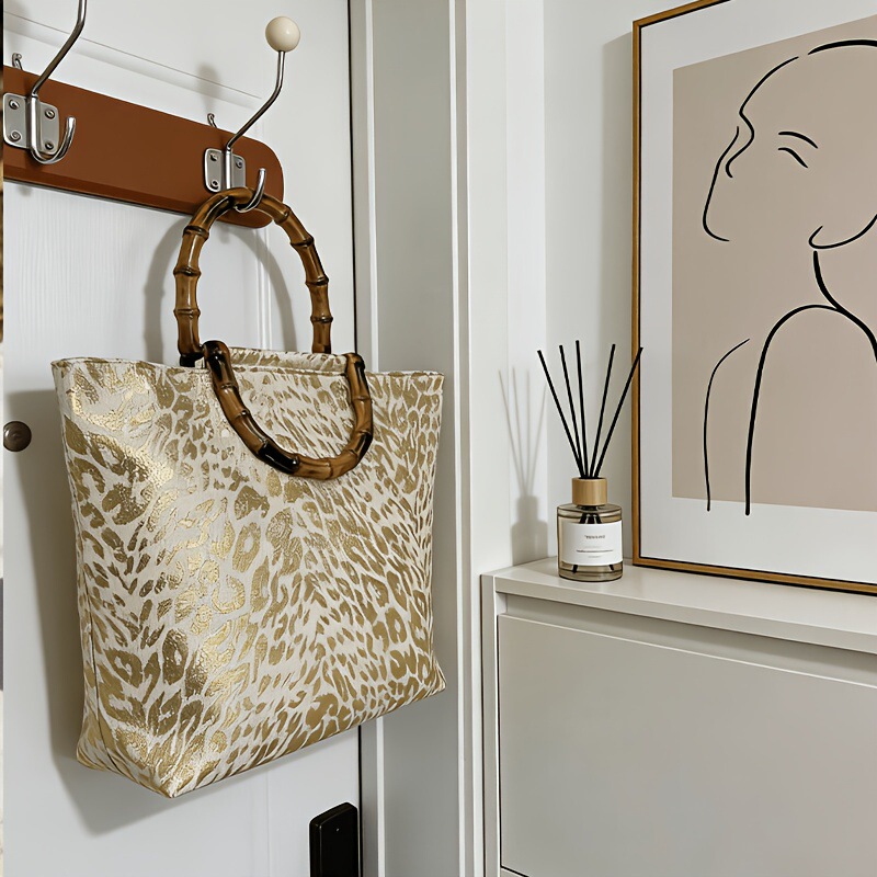 Gold-Stamped White Leopard Print Handbag with Faux Bamboo Handle. Gold-Stamped Leopard Print Women's Tote Bag Gold-Stamped White Leopard Print Handbag with Faux Bamboo Handle. Gold-Stamped Leopard Print Women's Tote Bag