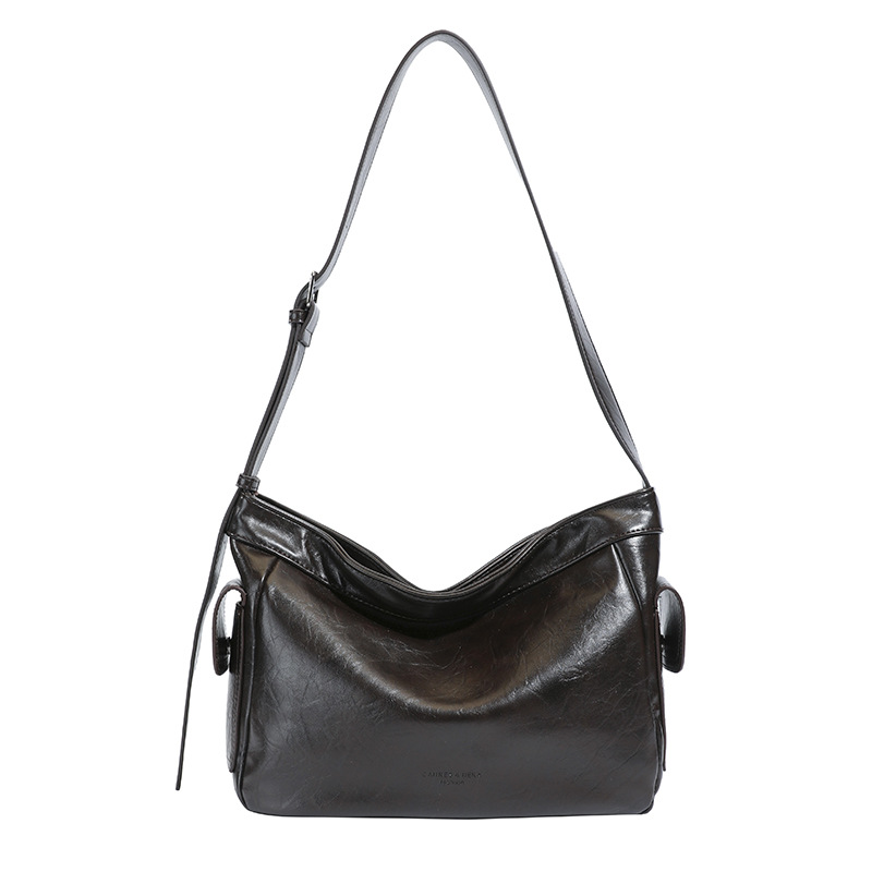 Retro perezoso estilo de viaje bolsas debajo de las axilas para mujeres otoño y invierno 2025 nuevo hombro ancho bolso de hombro nicho textura mochila