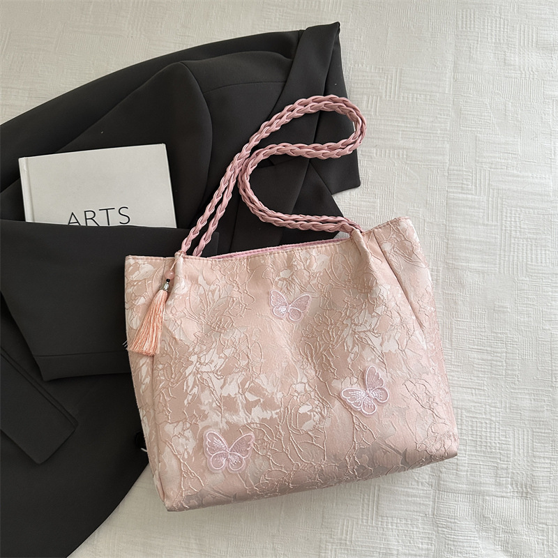 Bolso de viaje de seda de mariposa de alta calidad de nicho 2025 verano nuevo bolso de mujer simple de gran capacidad nuevo estilo chino