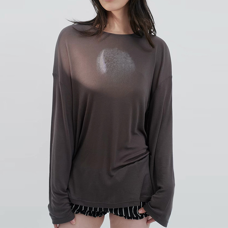 Zhao Lusi's style: a loose-fitting, slimming, long-sleeved Tencel blend top with a subtle, star and moon print and rhinestone embellishments, creating a cool and elegant look Zhao Lusi's style: a loose-fitting, slimming, long-sleeved Tencel blend top with a subtle, star and moon print and rhinestone embellishments, creating a cool and elegant look