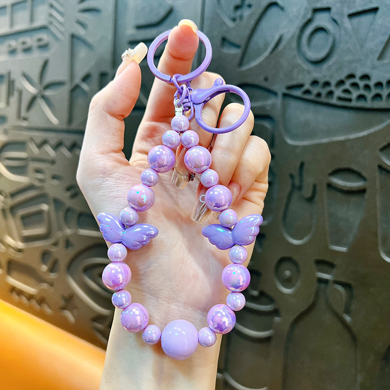 Sala de transmisión directa con alas recuerdos llaveros lindos colgantes de teléfonos móviles accesorios de bolsos llaveros de automóviles al por mayor