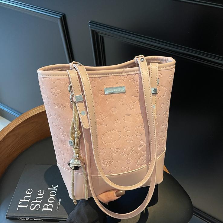 Bolso de tendencia versátil para mujeres 2025, nuevo bolso de cubo de moda casual, bolso de hombro de nicho de alta calidad