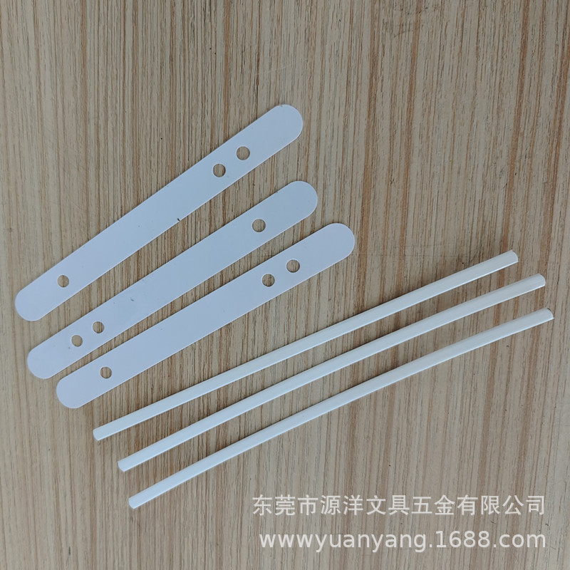 White plastic kitchen tongs