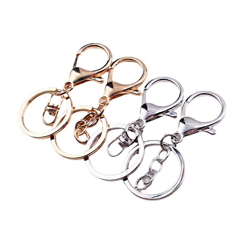 Fábrica al por mayor llavero anillo cadena colgante de metal accesorios langosta hebilla de tres piezas conjunto de protección de color plateado accesorios de joyería DIY