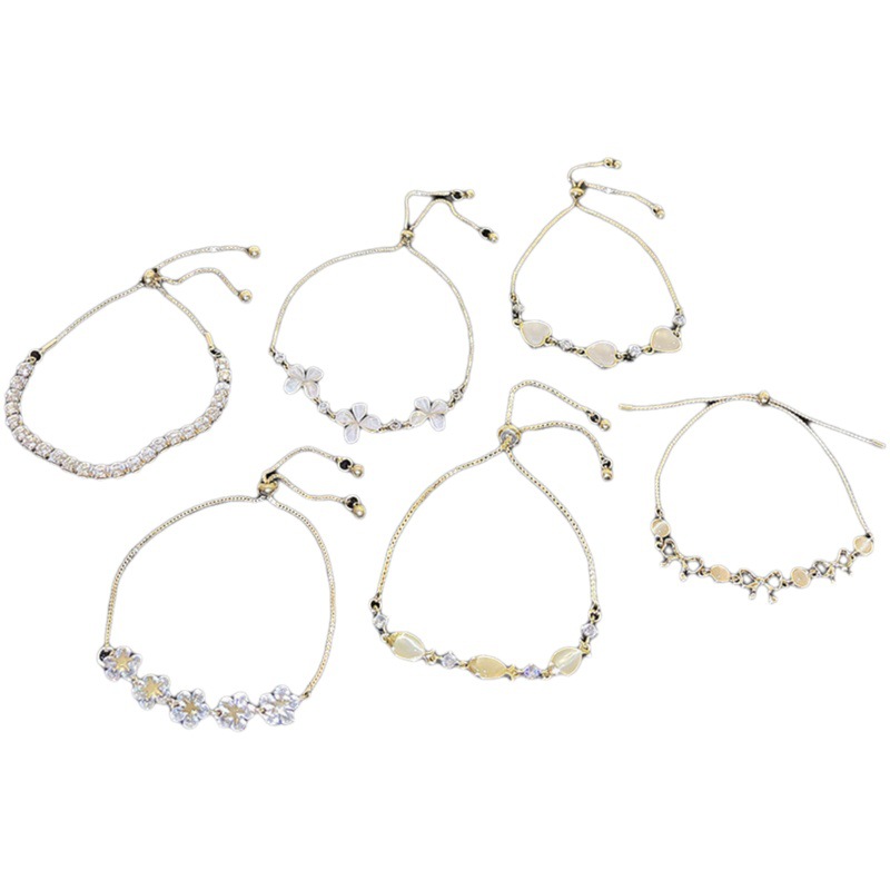 Estilo japonés y coreano Luz de lujo nicho perla pulsera Mujer al por mayor de gama alta de diseño sentido todo-fósforo circón flor pulsera joyería