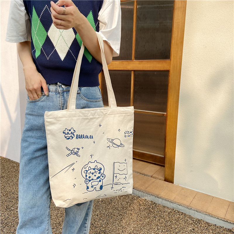 【 In Stock 】13173 Cute Moon Landing Cow single-shoulder Bag, student girls' schoolbag, canvas bag, large capacity wholesale undefined