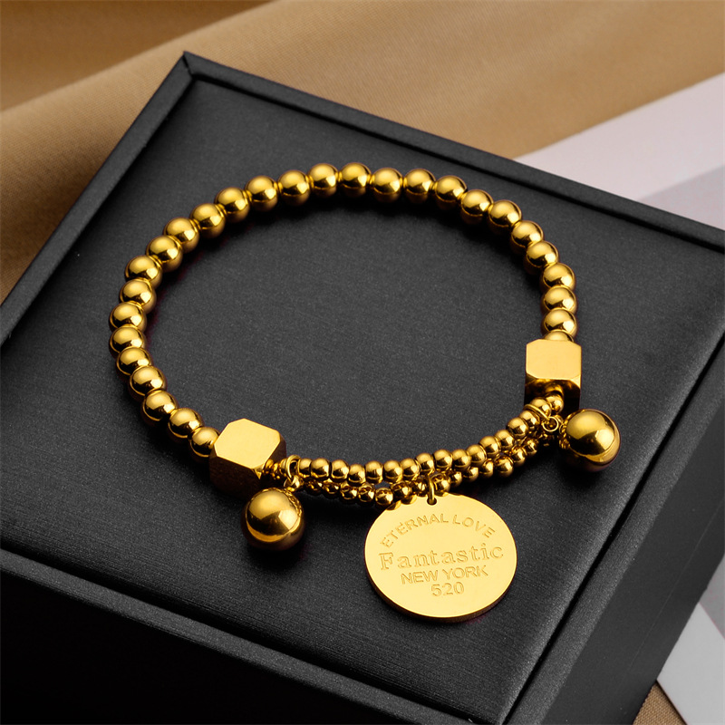Comercio exterior viento frío simple letras de disco de acero de titanio pulsera de alta gama europea y americana moda personalidad bungee joyas pulsera de mujer