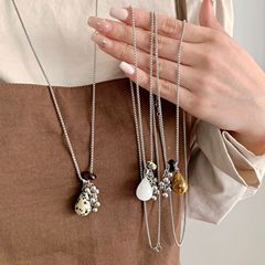 新商品のブドウの串の虎の目の石のネックレスの女性の大衆のデザイン感の復古の軽い豪華なファッションの百合の首の鎖の鎖