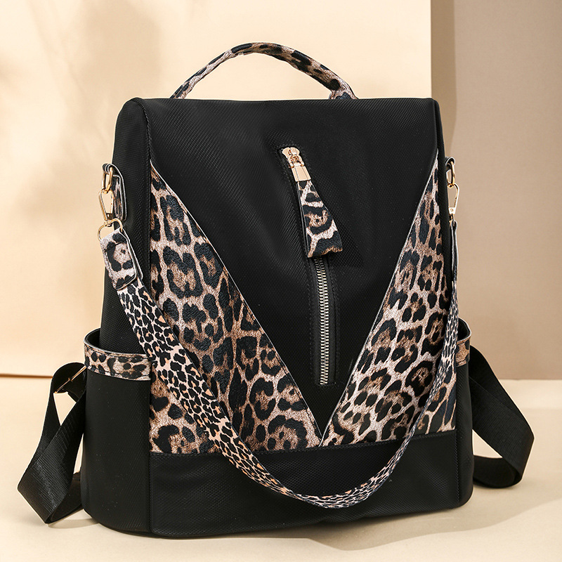 Spot wholesale 2025 nueva mochila antirrobo para mujer moda color de contraste mochila de nailon de viaje ligero bolso de doble uso