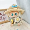Gray wood button sweater + small flowers + lucky hat + yellow kettle