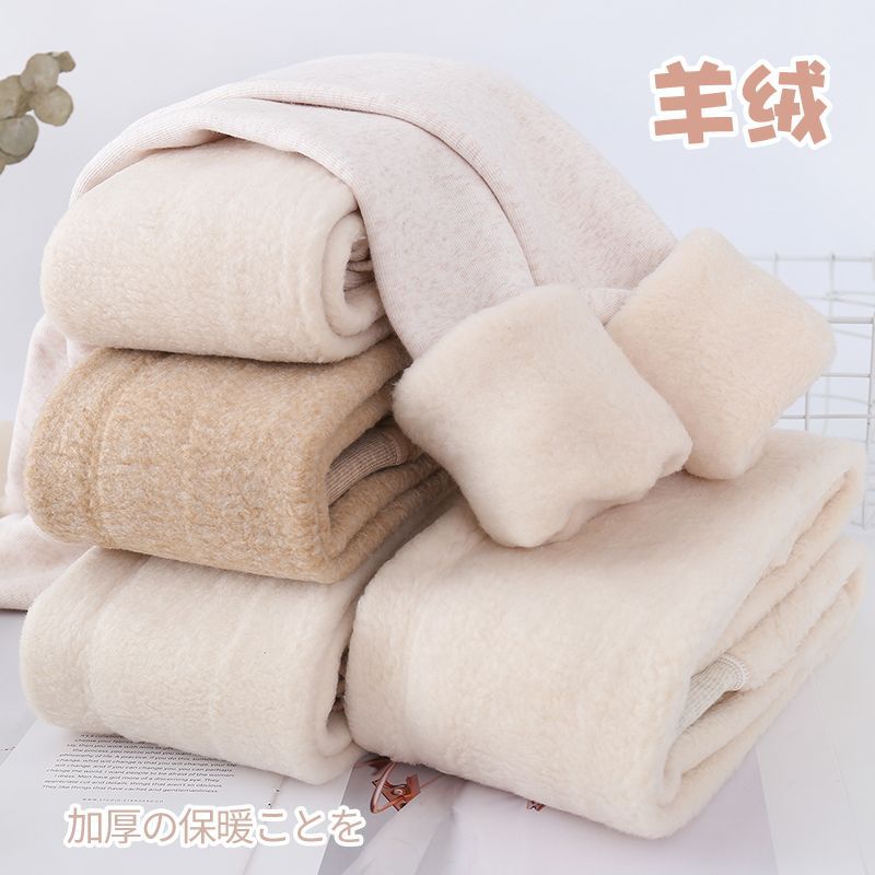 カシミヤの底のズボンの女性のベルベットの厚いズボンの靴下の春秋冬の系のオート麦の白い薄い色の縦の紋様の保温のズボンはやせています。