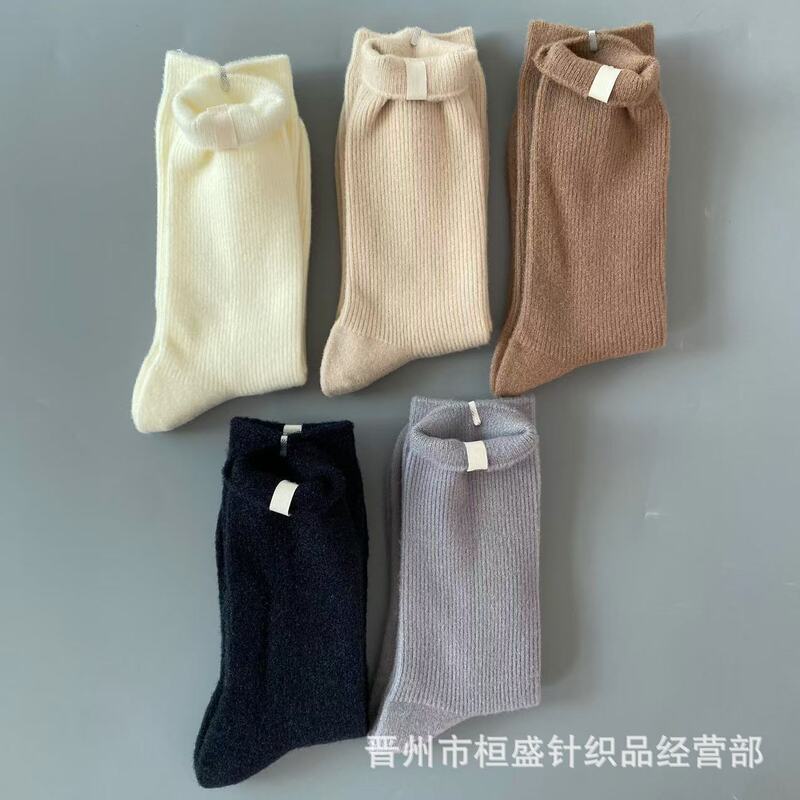 New autumn and winter foreign trade ugg socks women's pile socks cloth label solid color warm casual socks in the tube women's socks