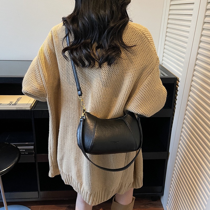 Bolso de viaje de nicho coreano para mujeres otoño / invierno 2025, nuevo estilo de moda retro bolso de hombro simple mochila casual