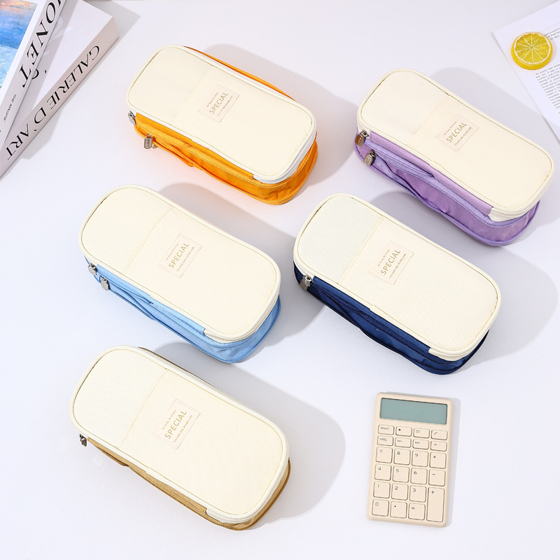 Bolso de lápices retráctil de lona de color de contraste de estilo explosivo transfronterizo Bolso de papelería de gran capacidad con doble cremallera simple multifuncional para estudiantes