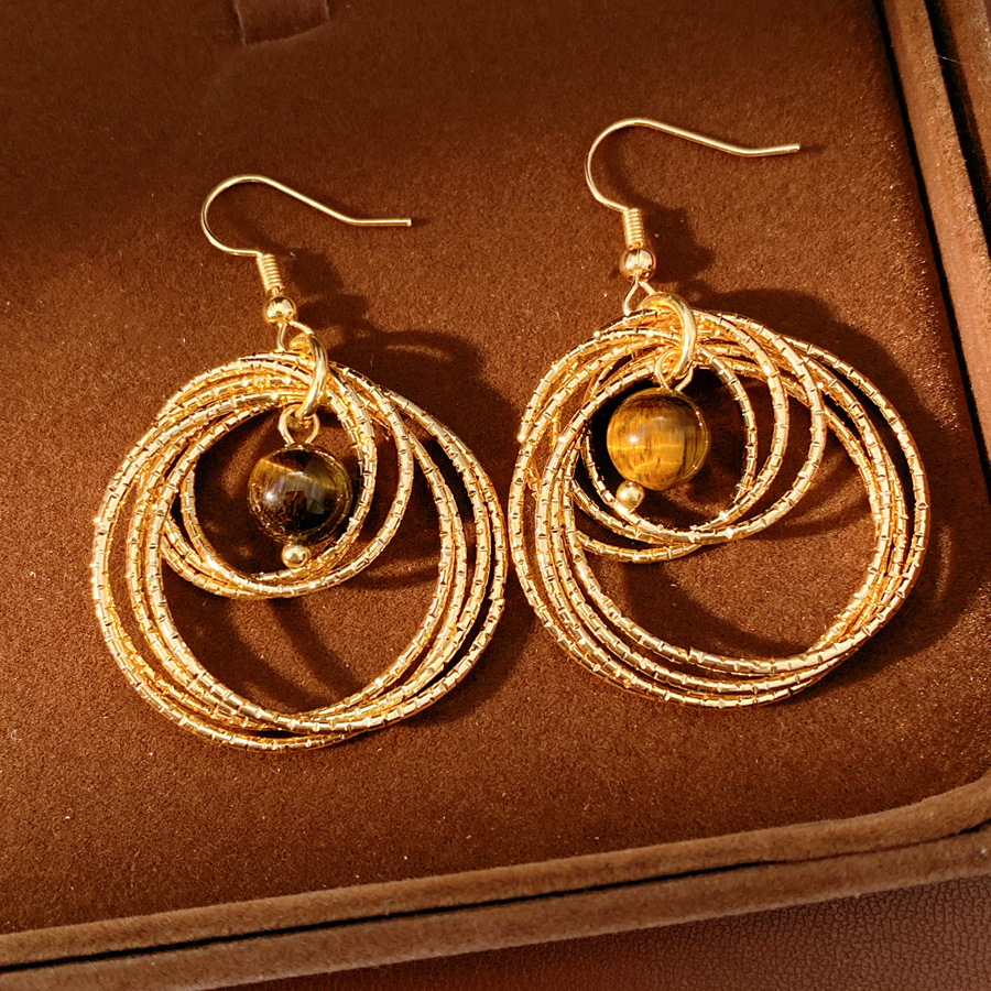 Medieval vintage ojo de tigre redondo hueco gancho de orejas temperamento temperamento temperamento aretes ligeros lujosos de alto nivel sensación de orejas