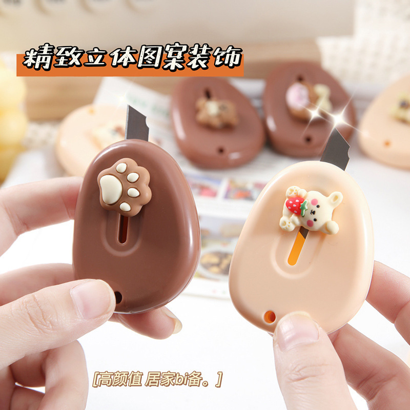Cute dibujos animados color crema arte cuchillo mini split expreso desembalaje cuchillo portátil corte mano cuenta papel corte cuchillo al por mayor