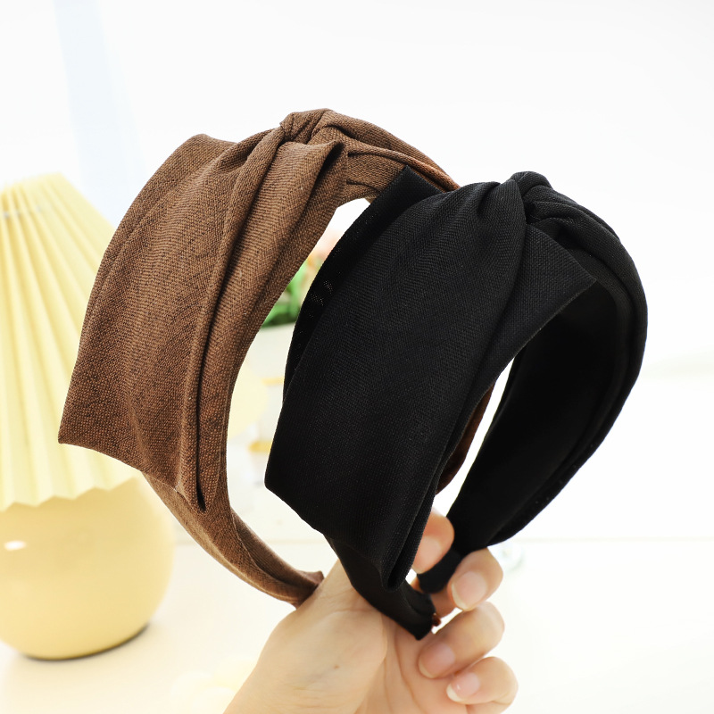 Korean Solid Color Wide-brimmed Fabric Cross-folding Headband Wholesale Nihaojewelry display picture 1