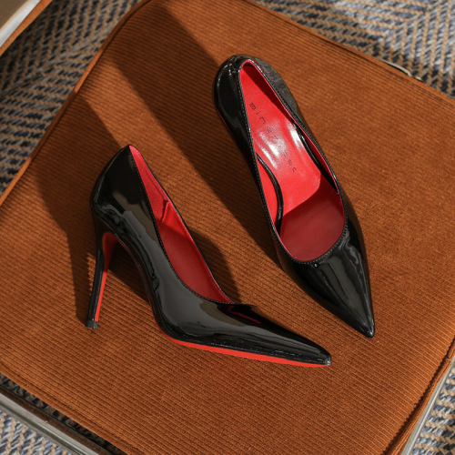 Black patent leather, minimalist, sexy low-cut designer women's shoes with a vibrant red lining and sky-high heels.