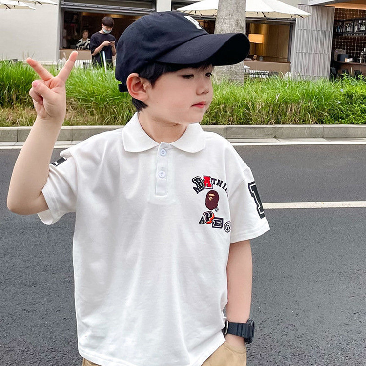 2023 Summer New Boys' Trendy Brand Letter Polo Shirt Small and Medium-sized Children's Black and White Short-sleeved T-shirt Lapel Top Trendy
