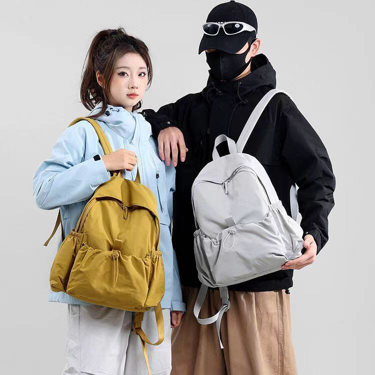 Cross-border best-selling Korean-style casual large-capacity student backpack for men and women, 2026 new lightweight outdoor sports and hiking model