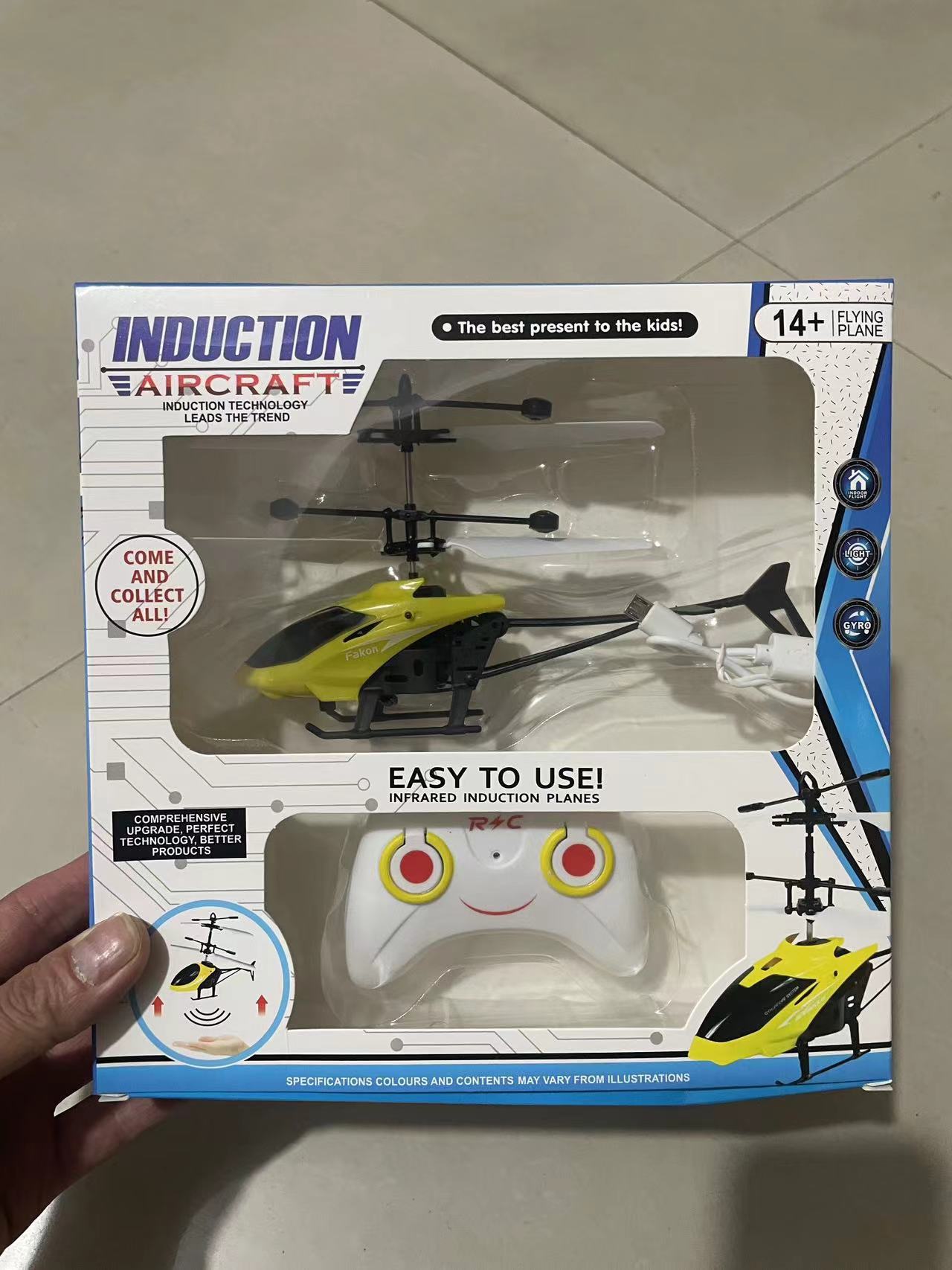 Fábrica de dos canales de control remoto helicóptero de inducción suspensión aviones juguetes eléctricos para niños Comercio exterior al por mayor