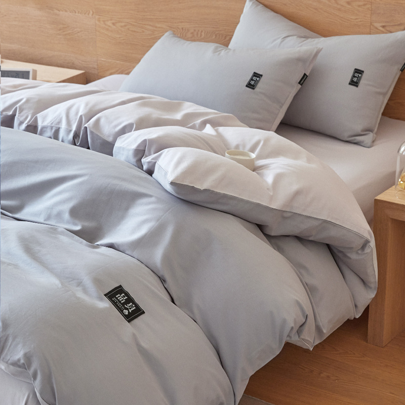 Nuevo traje de cama de algodón lavado de algodón de cuatro piezas de algodón 2025 nuevo traje de dormitorio de funda de edredón de sábana simple de tres piezas