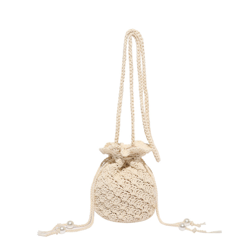 Versión coreana del bolso de cubo de nicho 2025 verano nuevo bolso femenino pequeño bolso de hombro de flores frescas bolso de mensajero tejido Mori