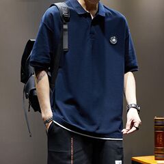 夏の偽の2つのポロシャツの男性の半袖のtシャツのゆったりした大きいサイズの上着のアメリカのカジュアルでかっこいいポールのシャツの潮