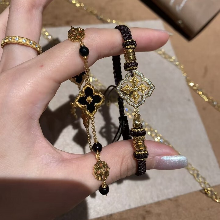 Retro black and gold, high-end, old-money style, lightweight luxury, intricately designed floral bracelet, trendy, stylish, and unique