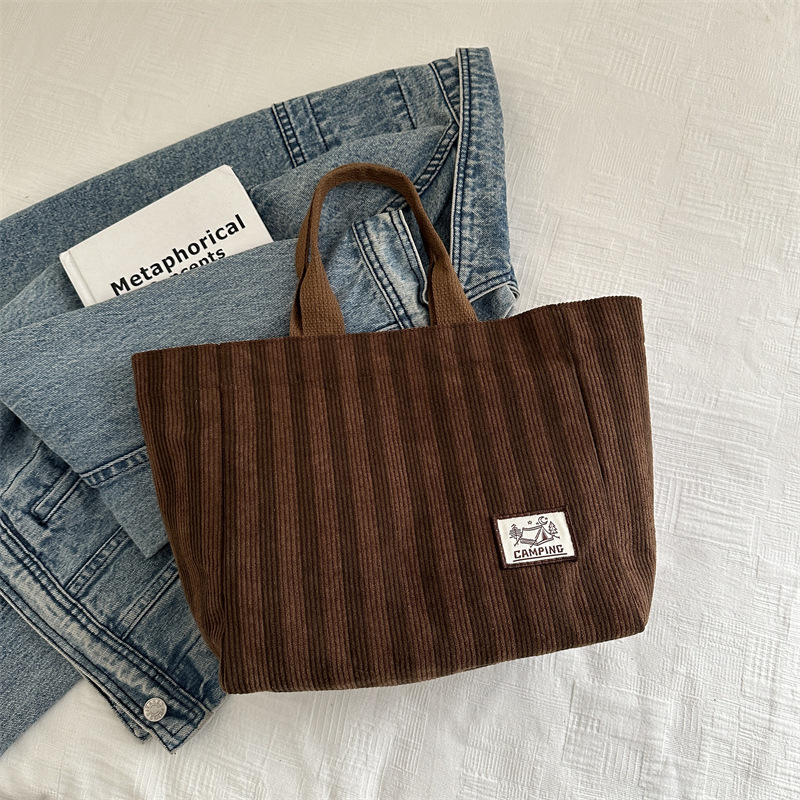 Bolso tote de tela a rayas de estilo europeo y americano, nuevo bolso pequeño de moda, bolso femenino portátil, bolso de almuerzo de mano, bolso de bocadillos