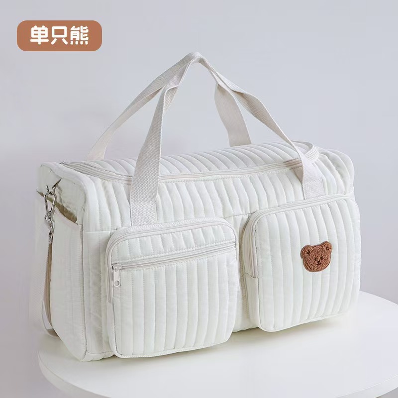Capacious travel bag for mother and baby