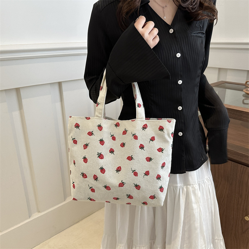 2026 nuevo bolso de transporte de gran capacidad impresión de fresas bolso de hombro de estudiantes